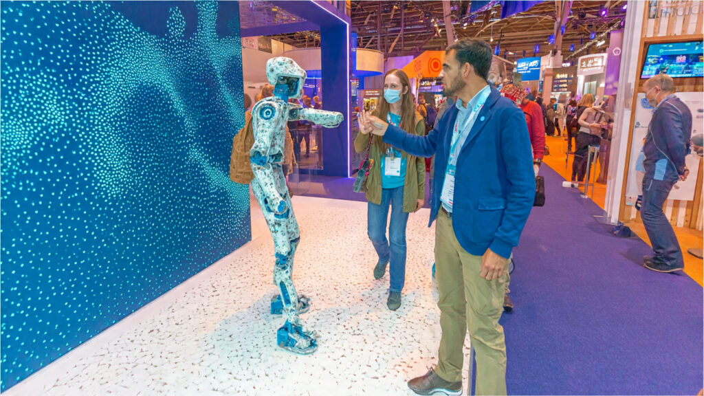 India to Host Global AI Impact Summit 2026 in New Delhi 1 inside a large ai technology expo hall 2