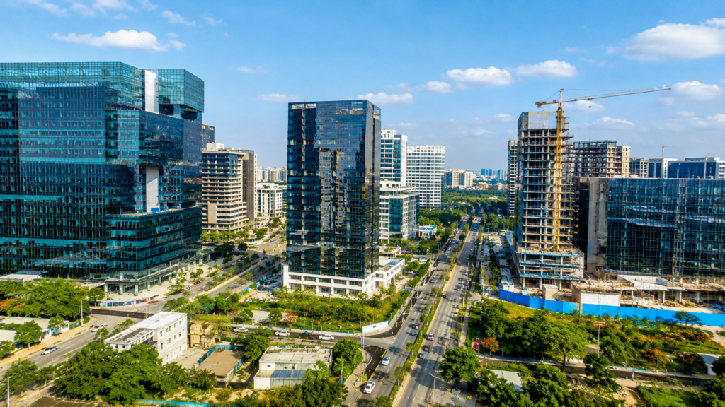 Hyderabad Raidurg Land Auction Fetches ₹204 Crore Per Acre 1 Modern commercial buildings and construction activity in Hyderabad's Raidurg Knowledge City, one of India's fastest-growing business and technology districts.